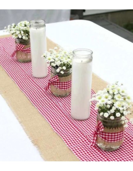 White wax candle in glass container