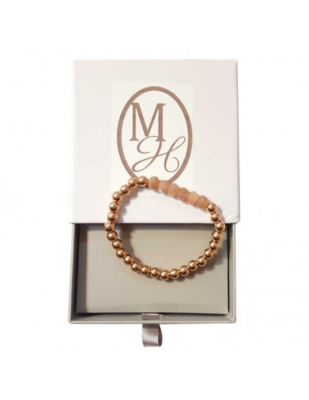 Armband mit dicken goldenen Perlen und facettiertem Sonnenstein.