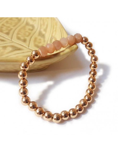 Bracelet with thick golden beads and faceted sunstone