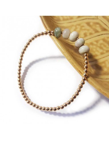 Bracelet with golden beads and round white jasper