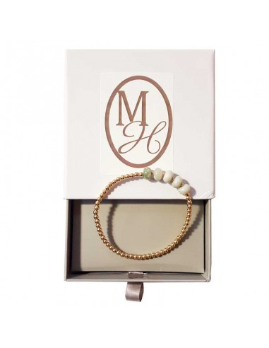 Bracelet with golden beads and round white jasper