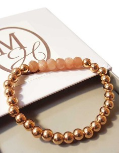 Armband met dikke gouden kralen en facetgeslepen zonnesteen